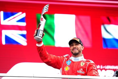 Lewis Hamilton of Great Britain and Scuderia Ferrari on the podium with his trophy during the F1 Grand Prix of Canada
