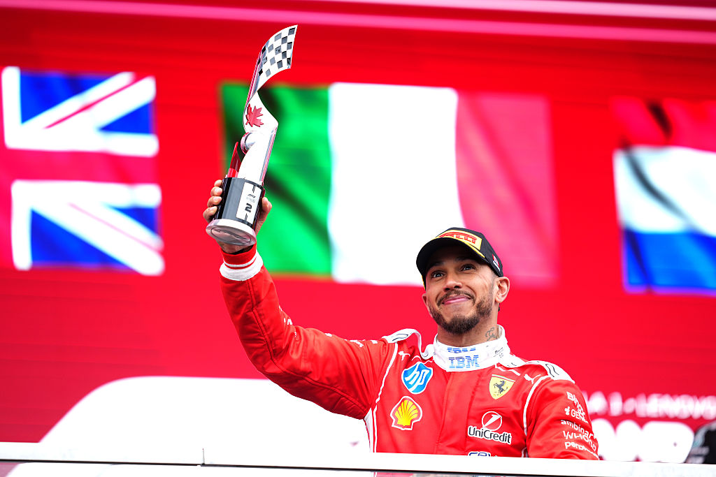 Lewis Hamilton of Great Britain and Scuderia Ferrari on the podium with his trophy during the F1 Grand Prix of Canada
