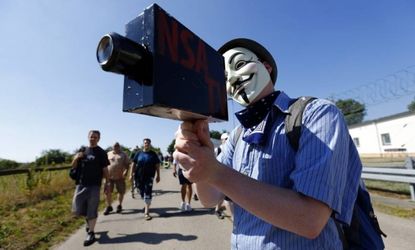 A protester demonstrates on July 20 against the NSA outside Germany's "Dagger Complex," which is used by the U.S. Army intelligence services.