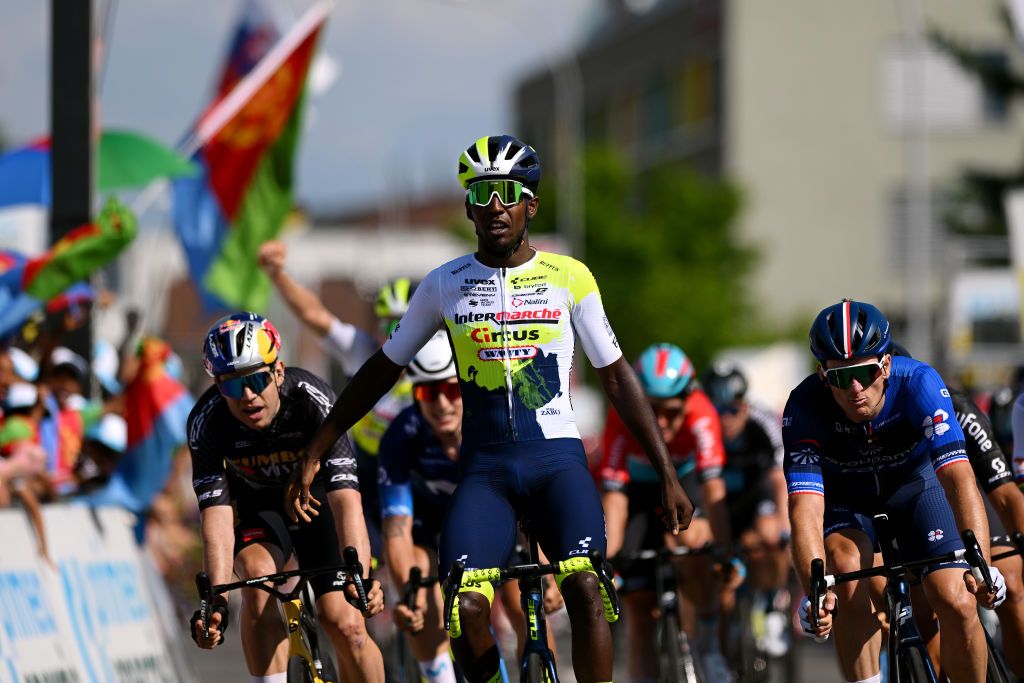NOTTWIL SWITZERLAND JUNE 12 Biniam Girmay of Eritrea and Team IntermarchCircusWanty celebrates at finish line as stage winner ahead of Wout Van Aert of Belgium and Team JumboVisma Black points jersey and Arnaud Dmare of France and Team GroupamaFDJ during the 86th Tour de Suisse 2023 Stage 2 a 1737km stage from Beromnster to Nottwil UCIWT on June 12 2023 in Nottwil Switzerland Photo by Dario BelingheriGetty Images