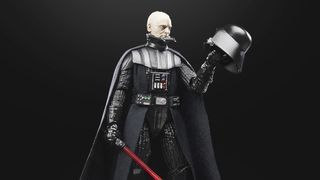 A Darth Vader action figure ponders on its helmet