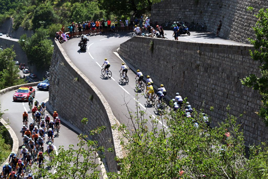 COL DE LA COUILLOLE FRANCE JULY 20 Tim Wellens of Belgium Nils Politt of Germany Pavel Sivakov of France Adam Yates of The United Kingdom Tadej Pogacar of Slovenia and UAE Team Emirates Yellow Leader Jersey Wout Van Aert of Belgium Matteo Jorgenson of The United States and Team Visma Lease a Bike Christophe Laporte of France Bart Lemmen of Netherlands and Team Visma Lease a Bike Mikel Landa of Spain and Team Soudal QuickStep and a general view of the peloton competing compete during the 111th Tour de France 2024 Stage 20 a 1328km stage from Nice to Col de la Couillole 1676m UCIWT on July 20 2024 in Col de la Couillole France Photo by Dario BelingheriGetty Images