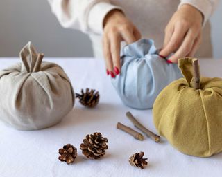 making linen fabric pumpkins for autumn decorations