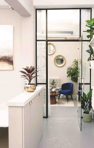 Light coloured office space with glass doors