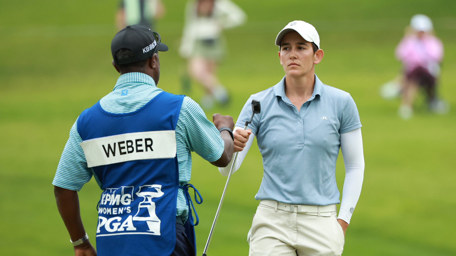 Dewi Weber fist pumps her caddie