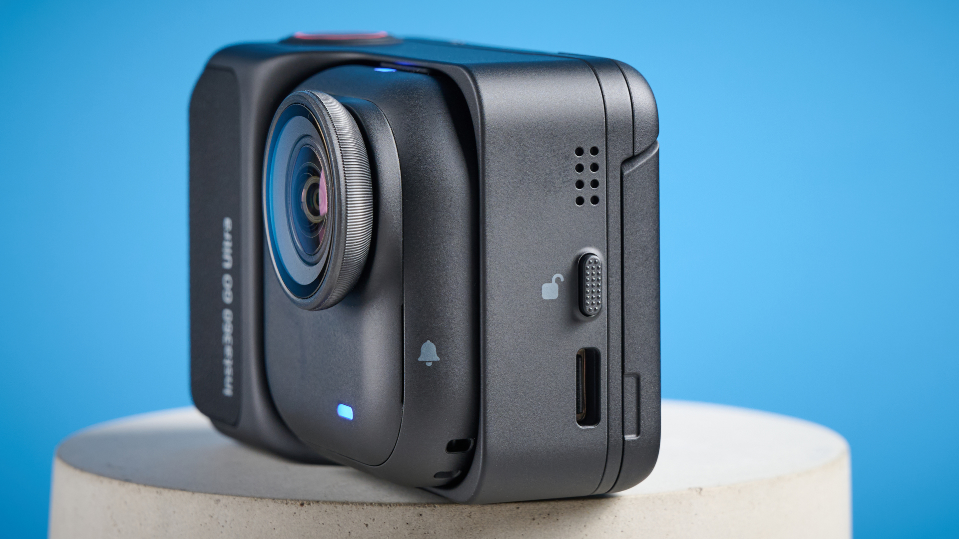 Insta360 Go Ultra against a blue background