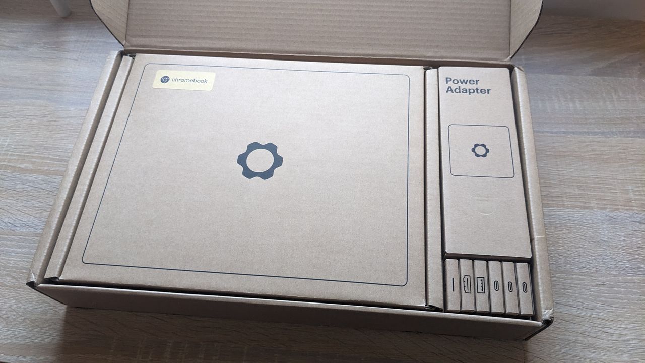 The Framework Laptop Chromebook Edition photographed on a wooden desk.