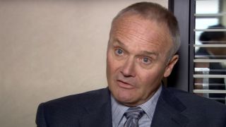 Creed talking to the camera in the office