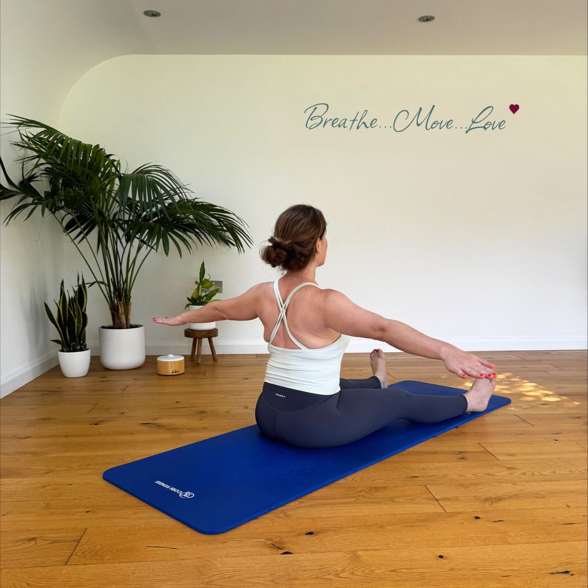 Health freelancer Anna Bartter trying Pilates moves recommended by a coach for healthy ageing