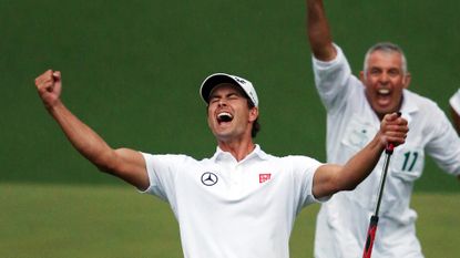 Adam Scott celebrates following winning putt at the Masters