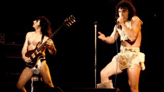 Manowar’s Joey DeMaio and Eric Adams performing onstage in the early 80s