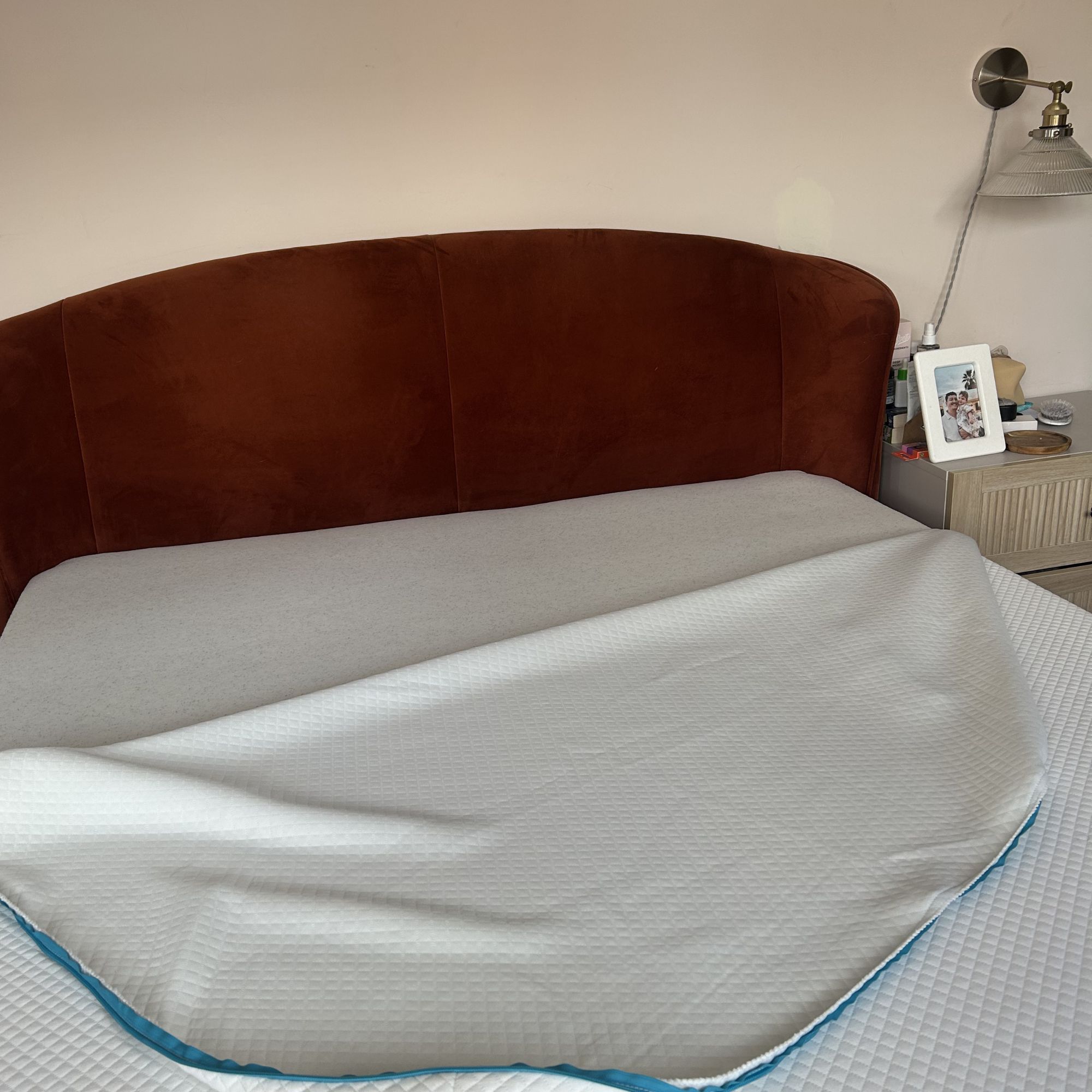 Simba mattress on bed frame with cover half off