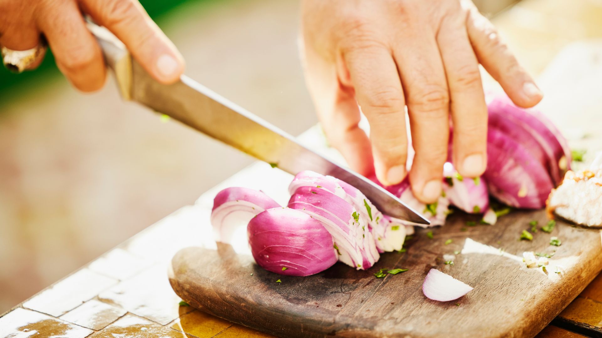 Woman chopping an onion