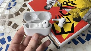 AirPods Pro 2 with Spatial Audio on a mosaic table