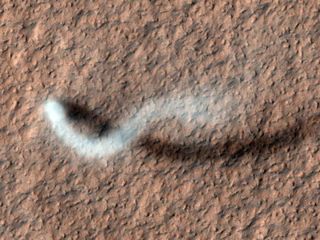 A giant dust devil, present on the surface of Mars, was imaged by the Mars Reconnaissance Orbiter.