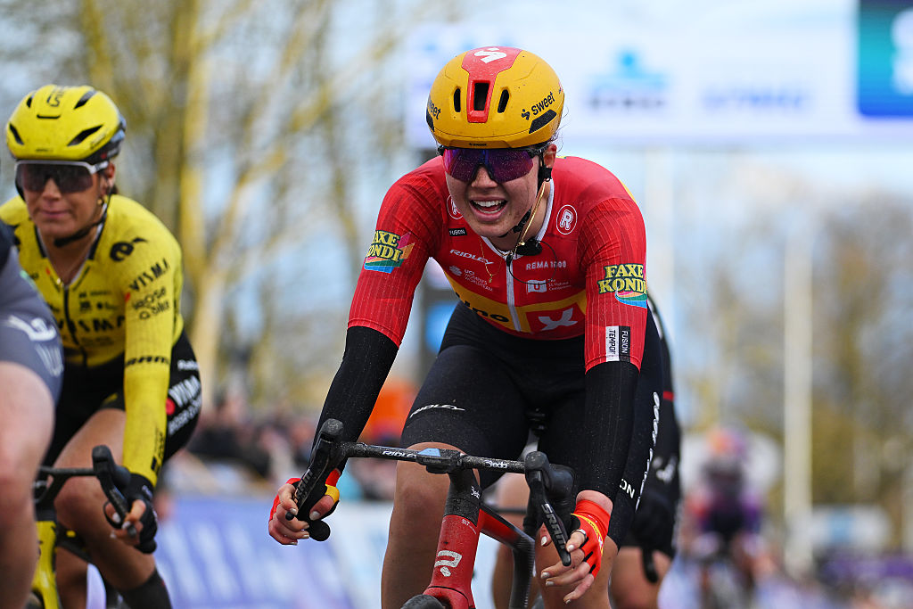 Kamilla Aasebo crosses the finish line during the 2026 Omloop Het Nieuwsblad 
