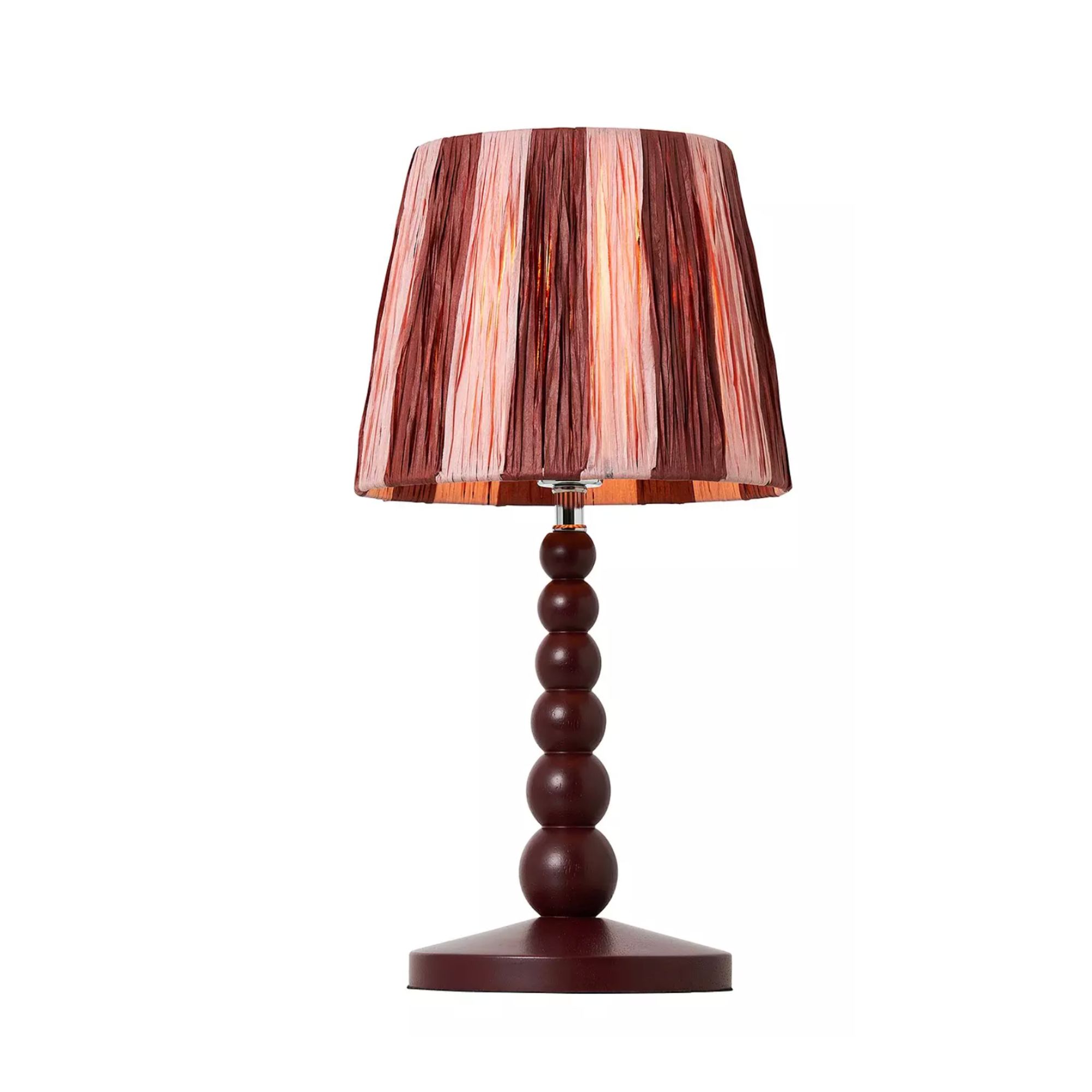 A burgundy bobbin lamp with pink and red striped shade