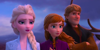 Elsa, Anna and Kristoff stand outside in a scene from 'Frozen 2'
