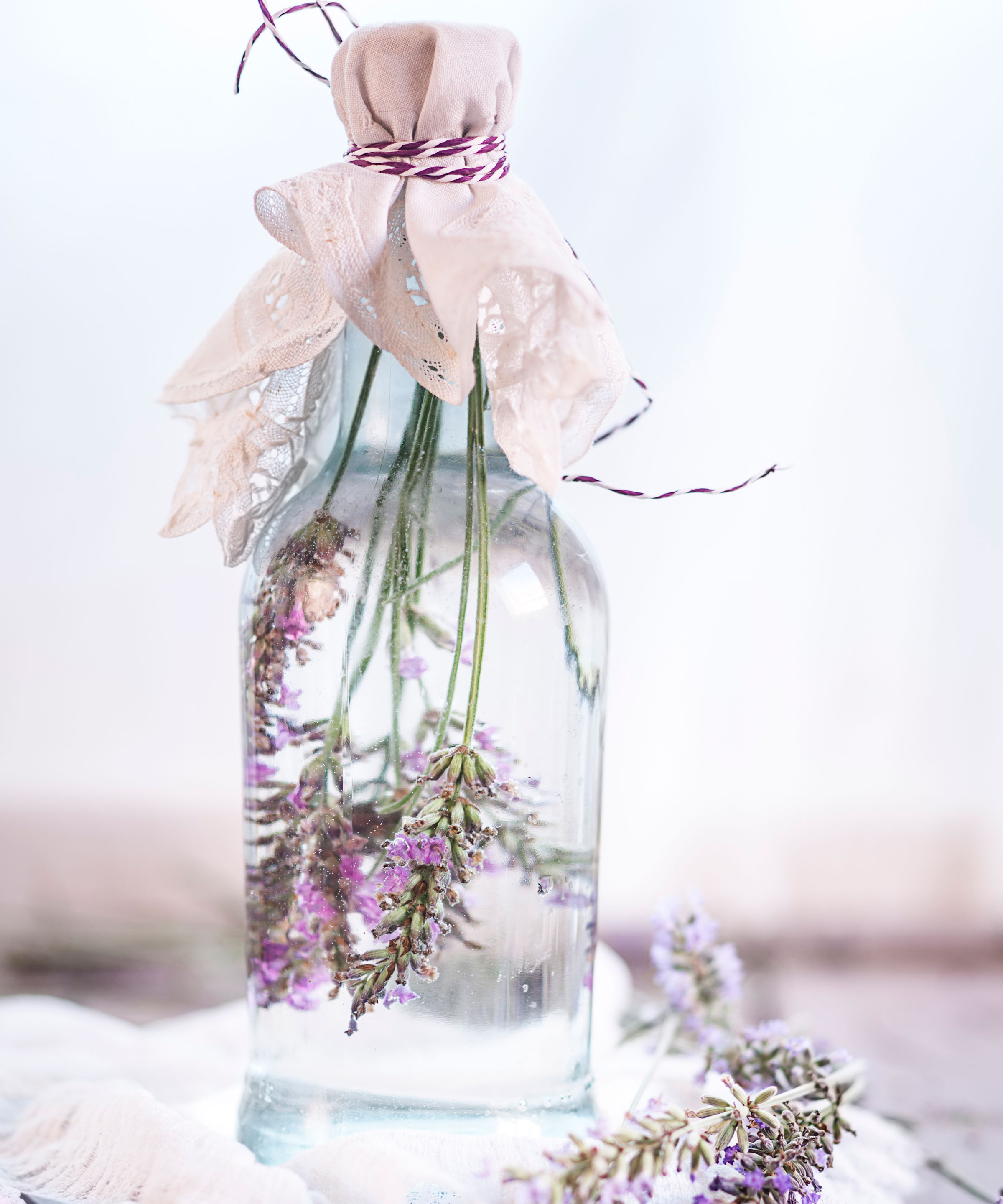 lavender stalks in bottle of water and sealed with fabric