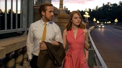 Ryan Gosling and Emma Stone hold hands in La La Land, one of November's new Hulu movies