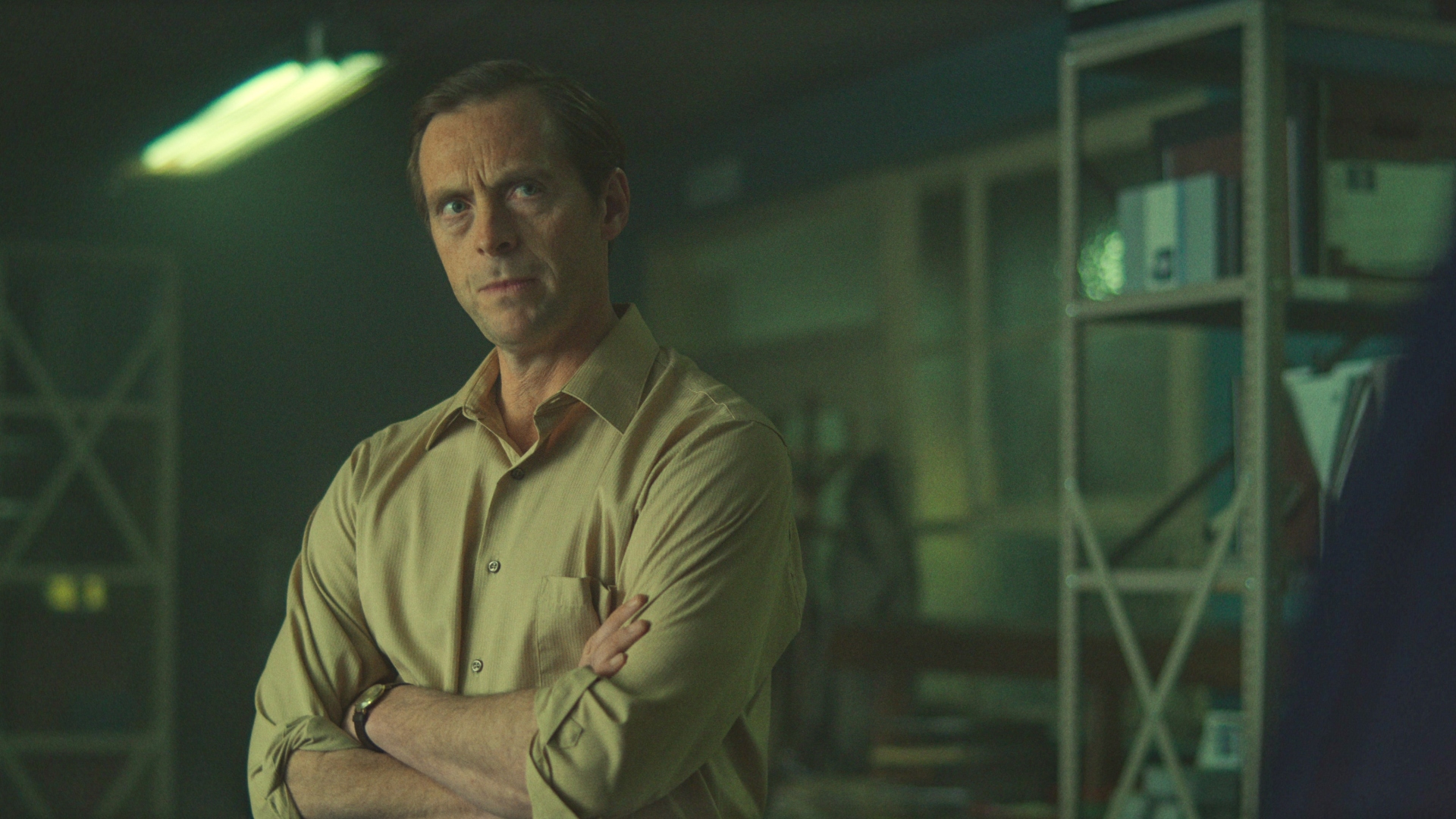 Lundy crosses his arms in The Gold season 2