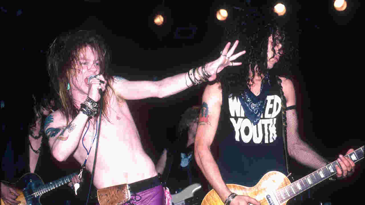 Guns N’ Roses’ Axl Rose and Slash performing onstage in 1987