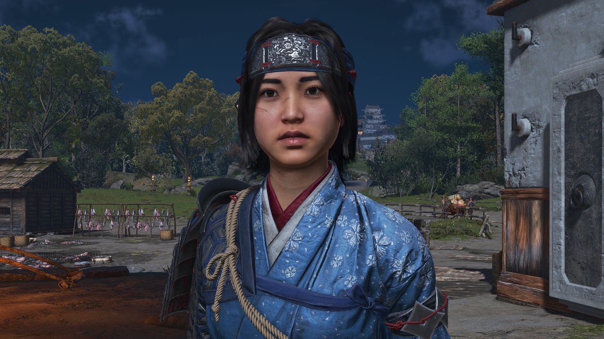 Best Assassin&#039;s Creed Shadows skills - A close-up shot of Naoe wearing a blue floral outfit and headband.