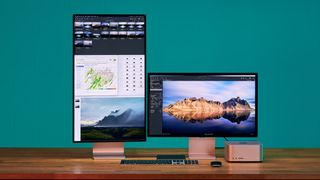 Two Apple Studio Display monitors, in both landscape and portrait orientation