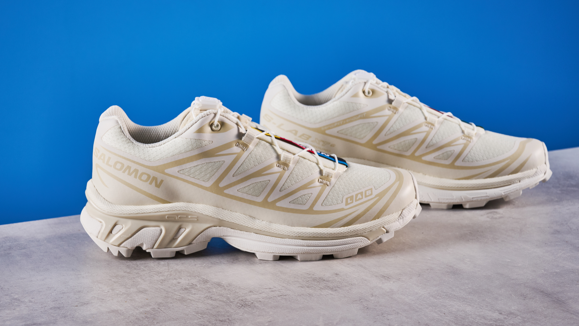 Salomon XT-6 in Vanilla Ice photographed in front of a blue background