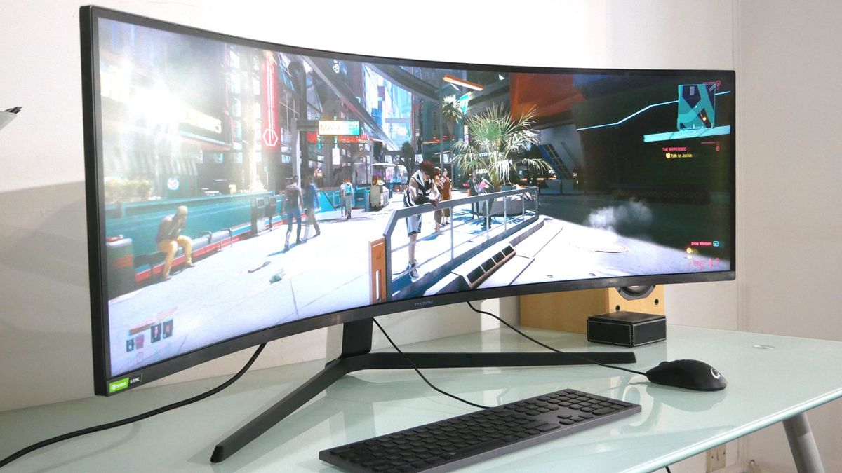 Samsung Odyssey G9 sitting on desk with Cyberpunk 2077 on screen