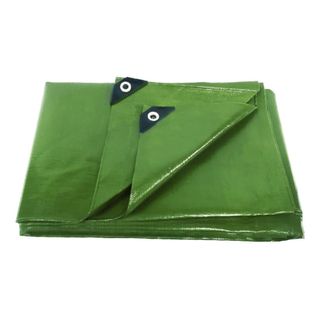 Green tarpaulin folded up on a white background with black holes in the corner