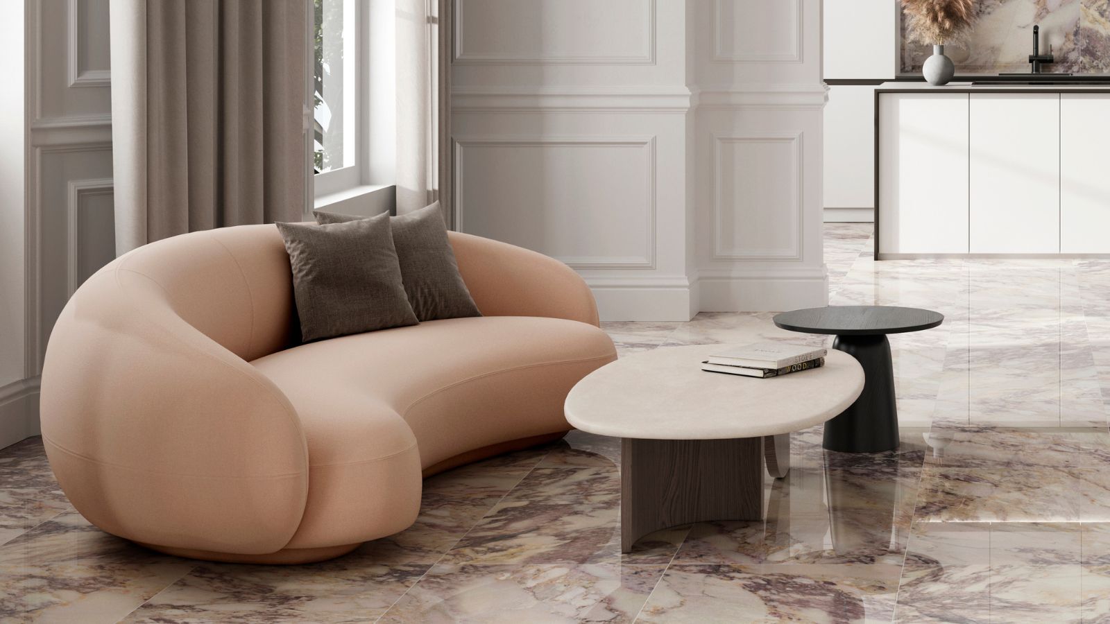 A luxurious living area featuring polished marble-effect floor tiles with warm veining. A sculptural blush sofa and minimalist coffee tables sit against classic panelled walls, showcasing how bold flooring can anchor a refined, modern interior.