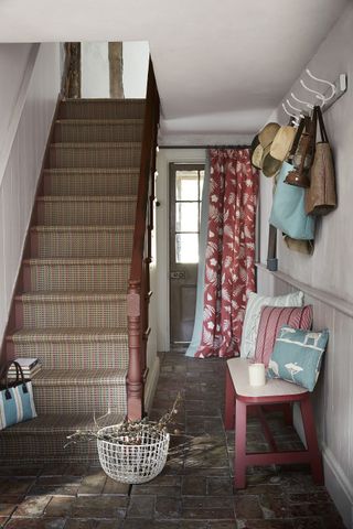 Vanessa Arbuthnott prints in a hallway and stairs in cottage staircase ideas