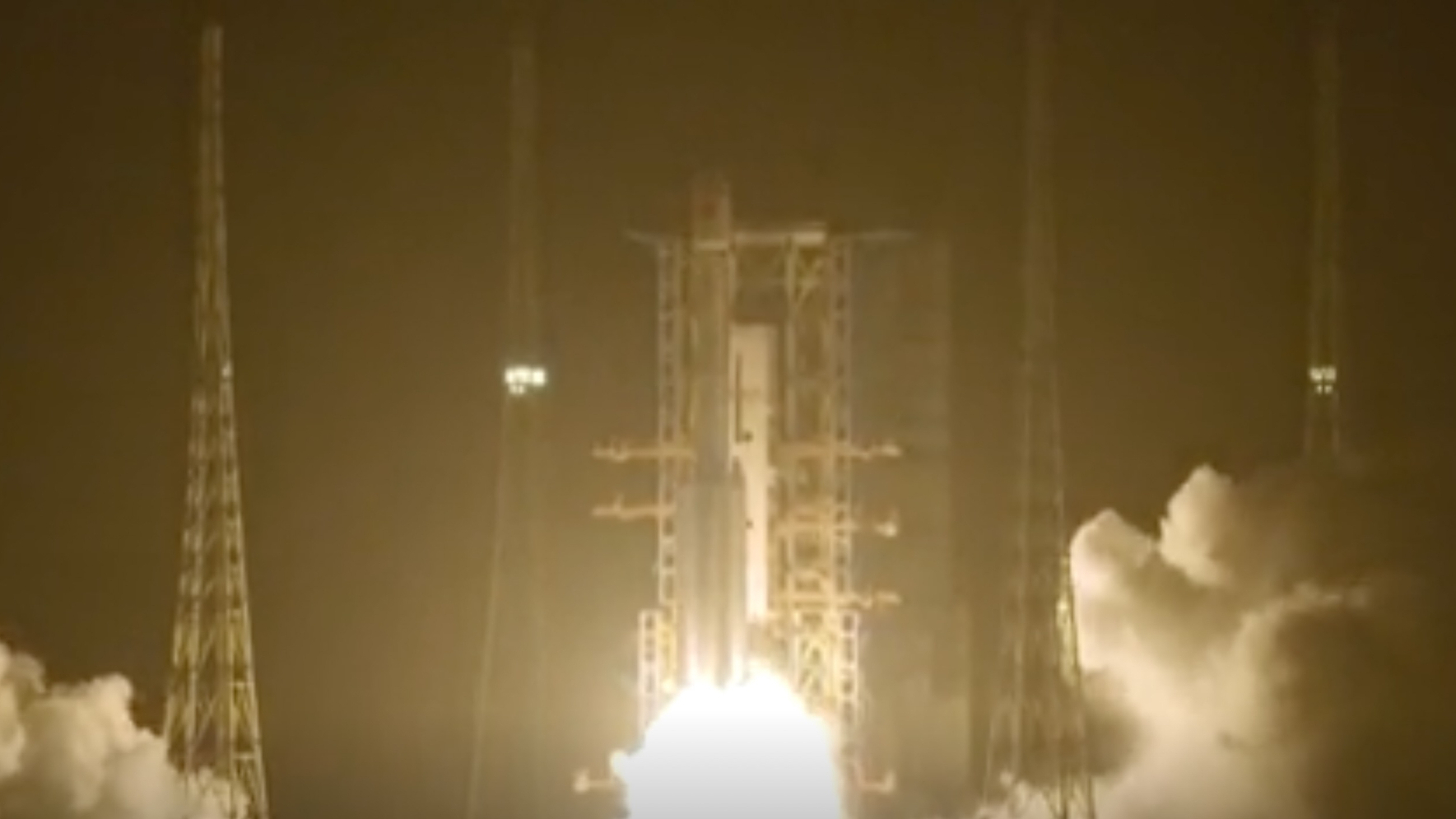 NASA Space Technology a white rocket launches into a night sky