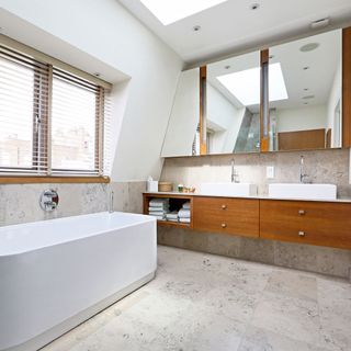 white bathroom with bathtub and tale top washbasin