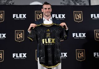 Forward Gareth Bale holds the Los Angeles Football Club jersey during a news conference after he was introduced at Banc of California Stadium on July 11, 2022 in Los Angeles, California