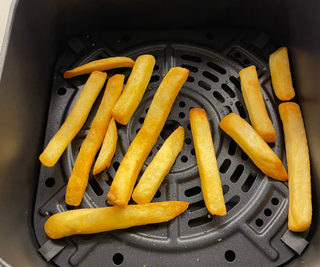 Ninja Air Fryer Pro 4-in-1, with cooked fries in the basket