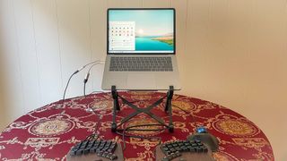 Nexstand Laptop Stand on a table holding up a laptop