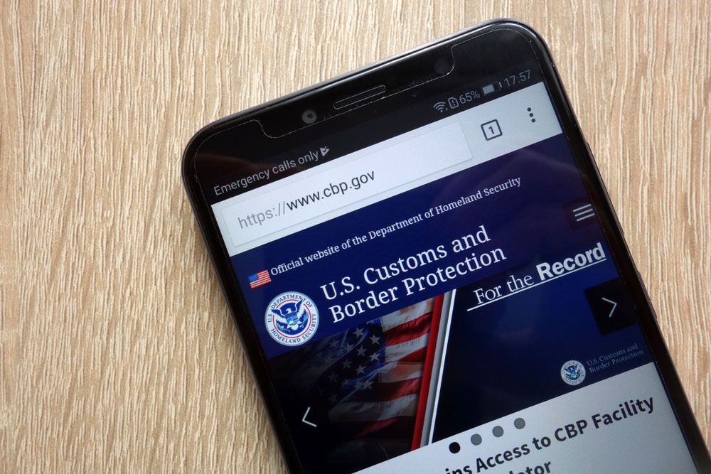 An iPhone displaying the website of U.S. Customs and Border Protection.