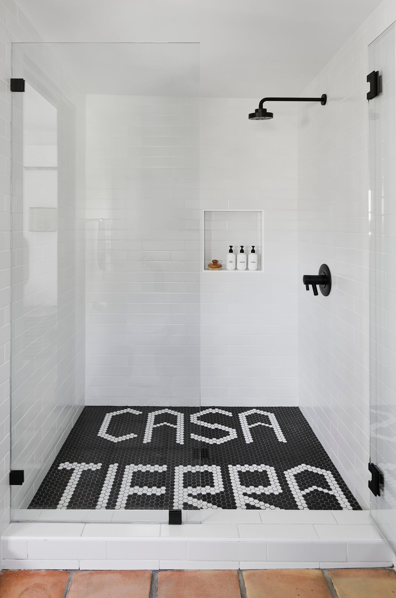 a shower with word tiles