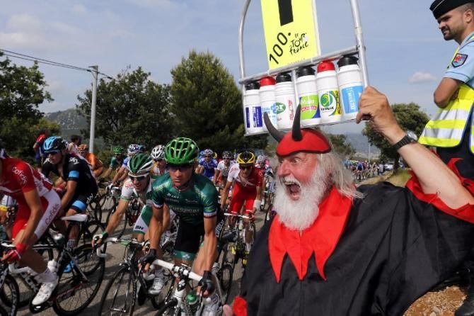 The devil cheers on the riders