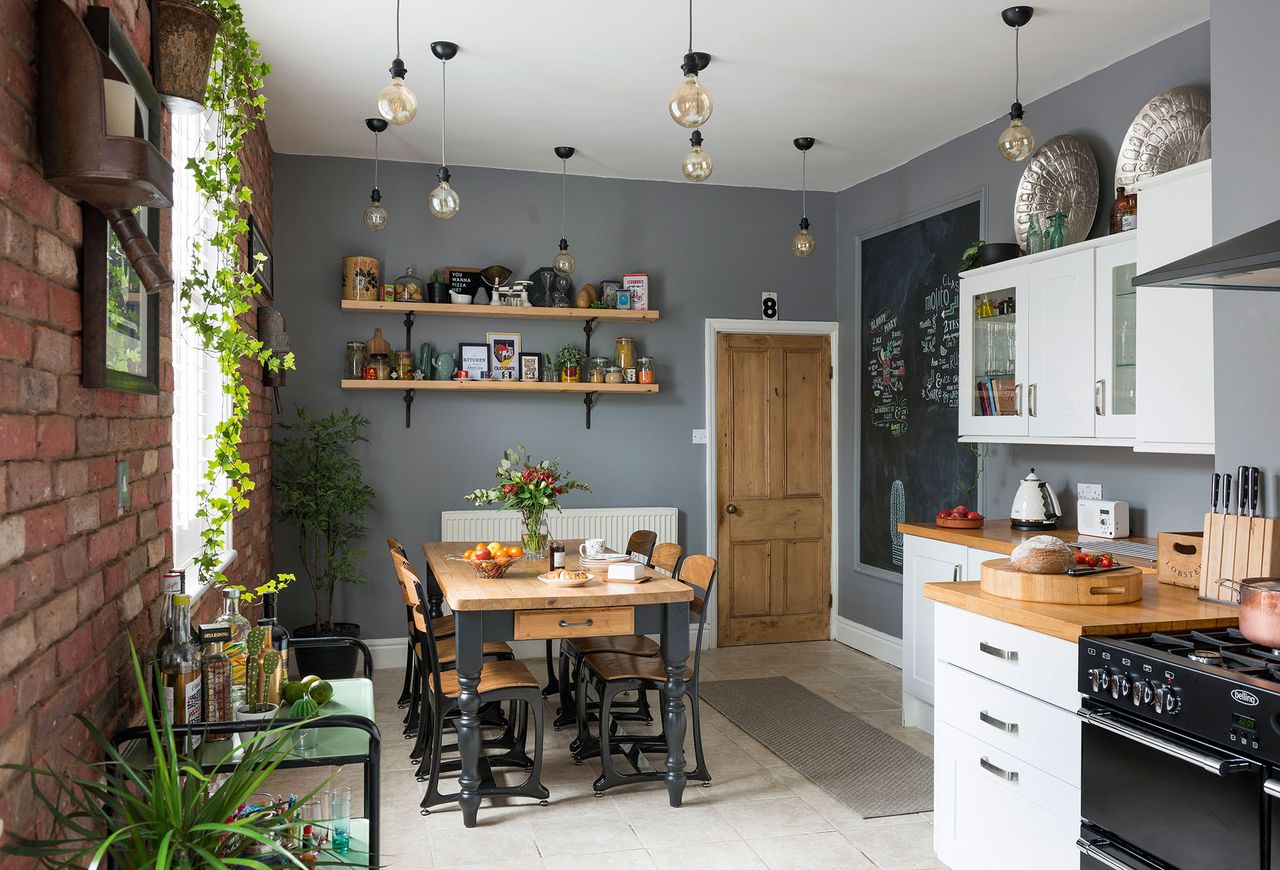 modern kitchen diner with exposed wood, grey walls and a bar trolley