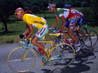 Race leader Marco Pantani (Mercatone Uno) rides ahead of compatriot and Italian road race champion Andrea Tafi (Mapei) on stage 18 of the 1998 Tour de France. Pantani's using an earlier 'Pirate' design on a Selle Italia Flite saddle, similar to the design of the Flite Classic saddle that celebrated his 1998 Giro-Tour double featured here