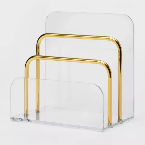A clear acrylic and gold bar letter tray