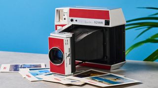 A red and gray Lomography Lomo'Instant Square Glass instant camera