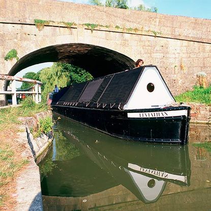 houseboat with bridge and water