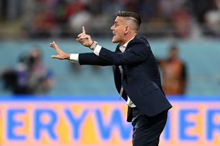 Canada coach John Herdman gives instructions in a game against Croatia at the 2022 World Cup.