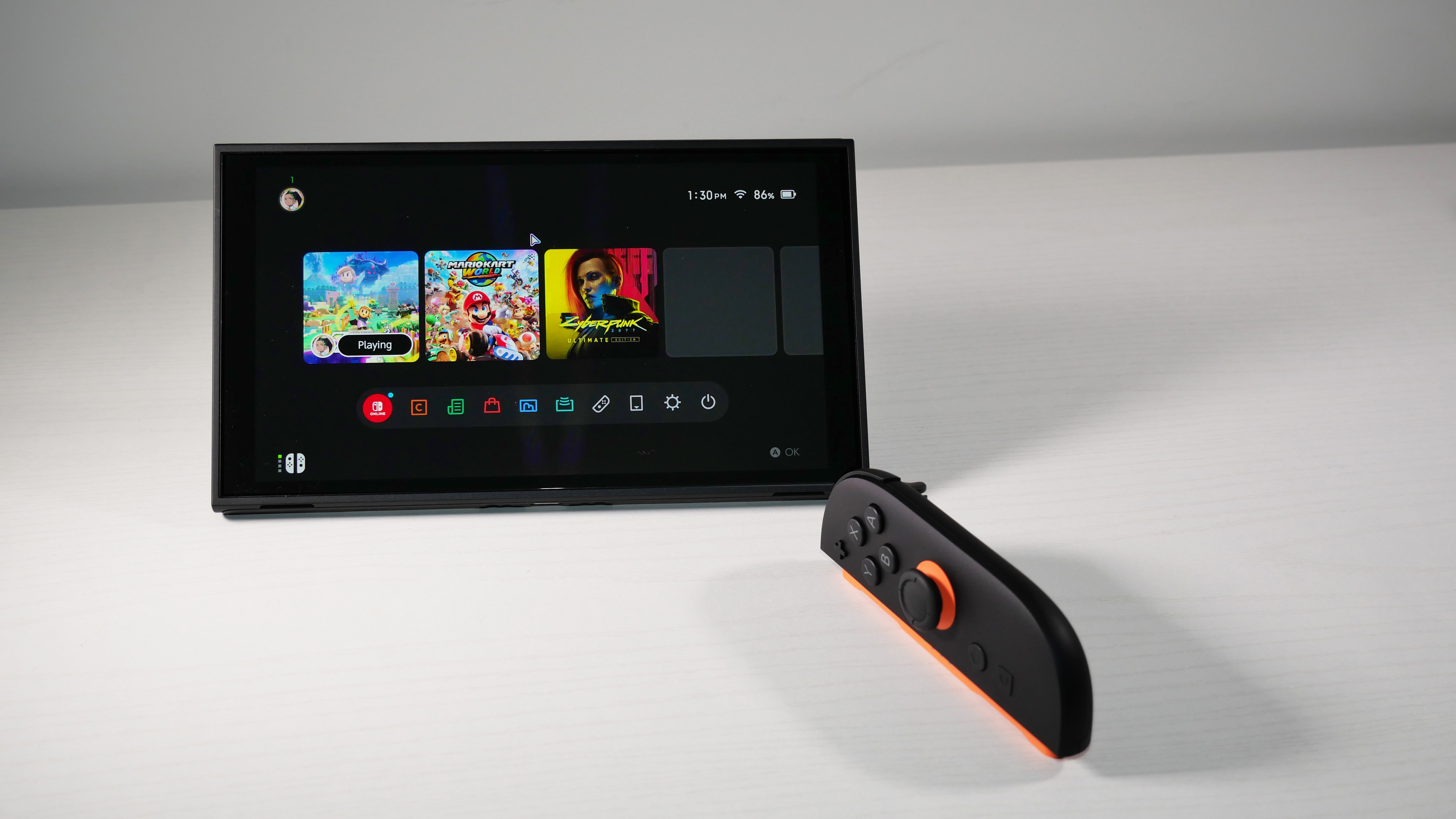 Nintendo Switch 2 in Mouse Mode on a white desk.