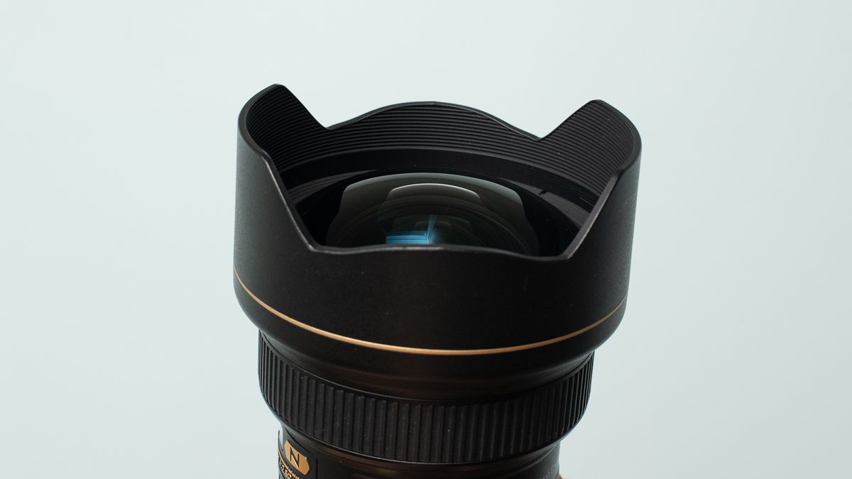 Image shows the front element and fitted hood on the Nikon AF-S 14/24mm f/2.8 ED lens.