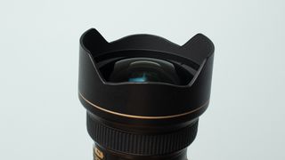 Image shows the front element and built-in lens hood on the Nikon AF-S 14/24mm f/2.8 ED .